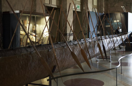 canoe with paddles in a museum gallery